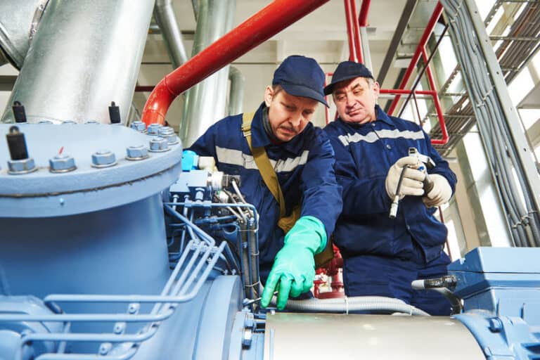 service engineer worker at industrial facility repairing and adjusting equipment